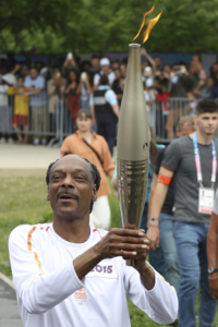Snoop Dogg Shines as Torchbearer Amid Olympic Excitement and Railway Disruptions in Paris